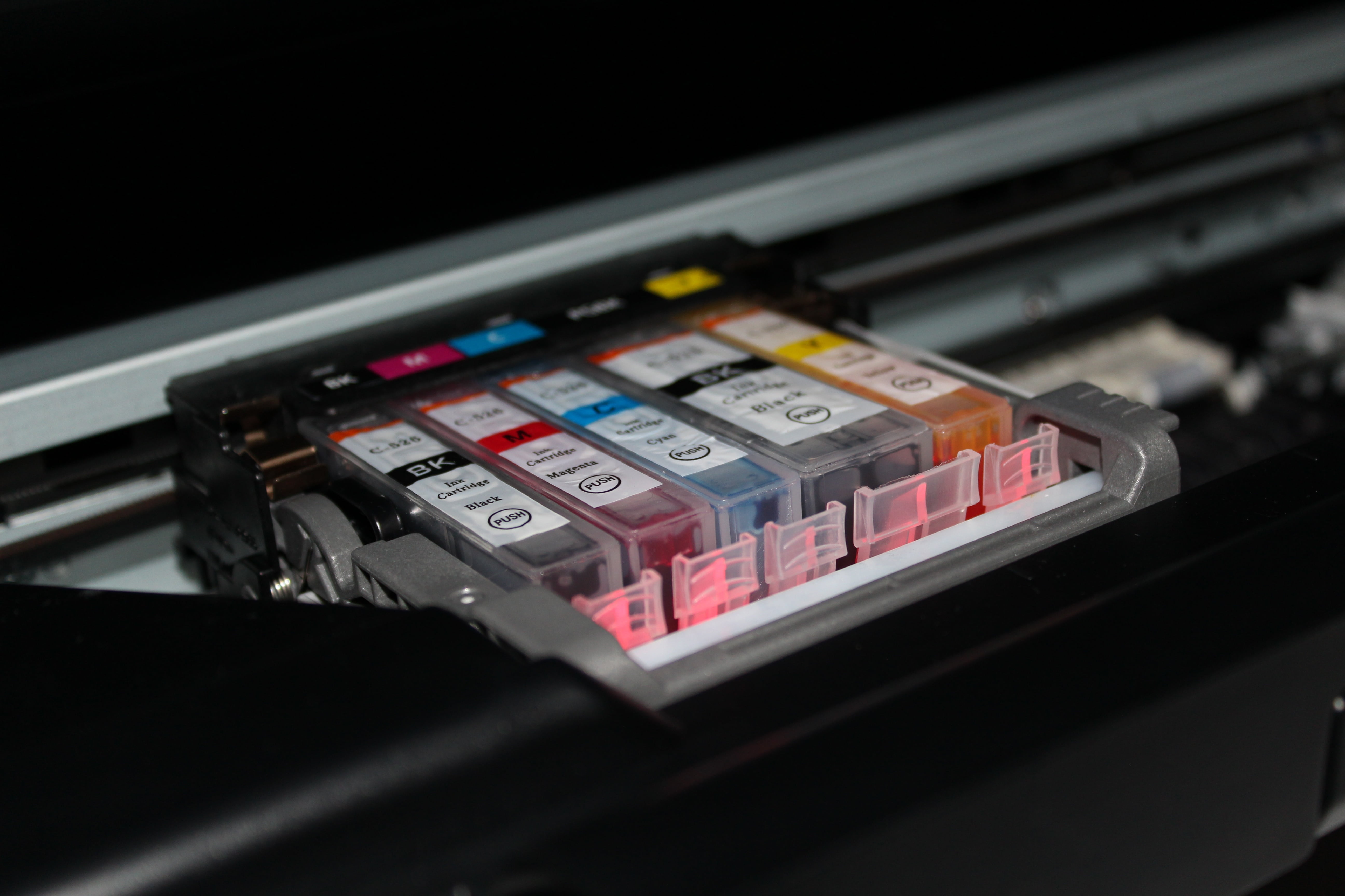 macro shot photography of ink cartridges cmyk printer colors 2k 4k 5k