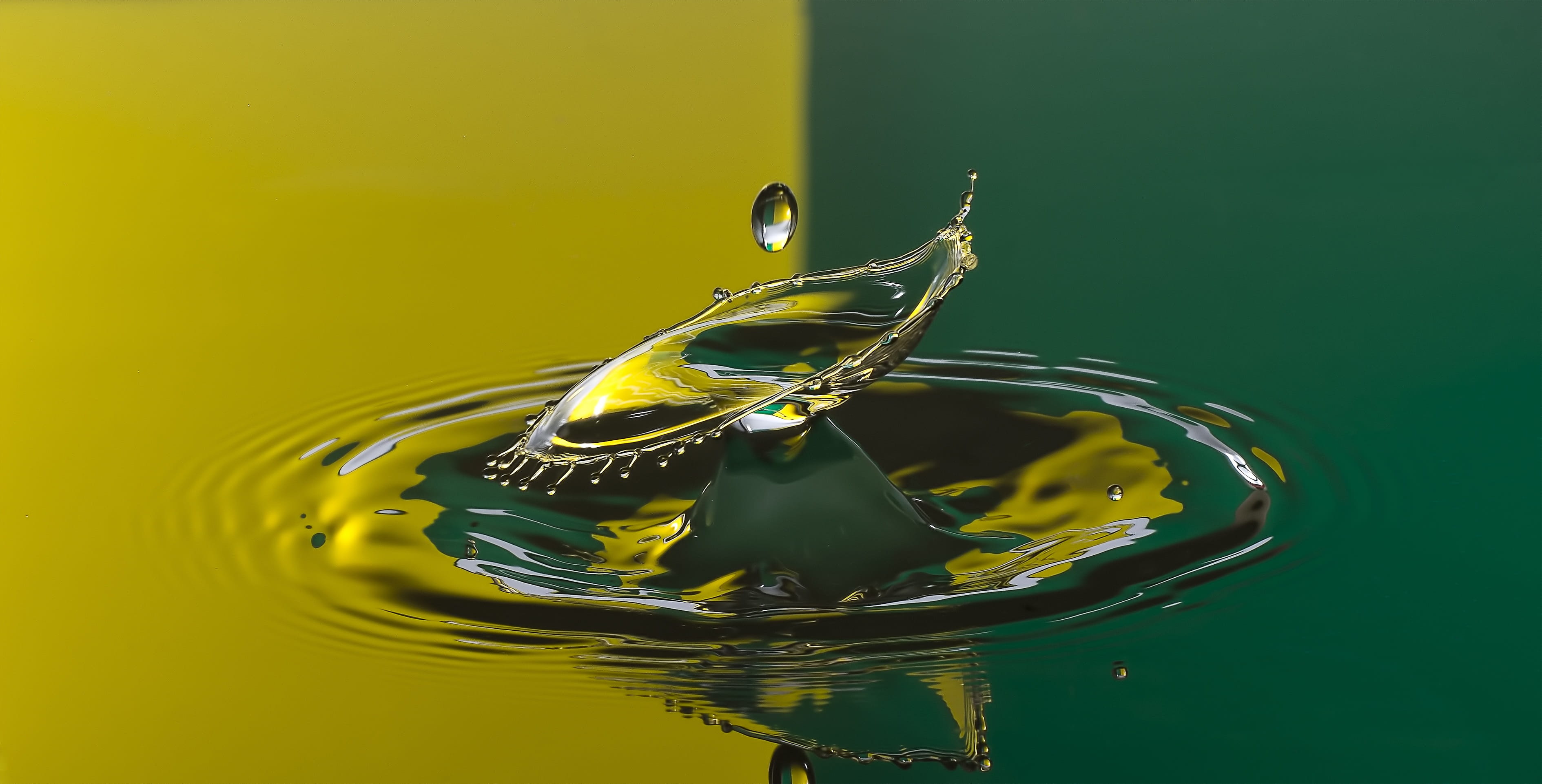 water drop on surface Yellow Green drops highspeed 2k 4k