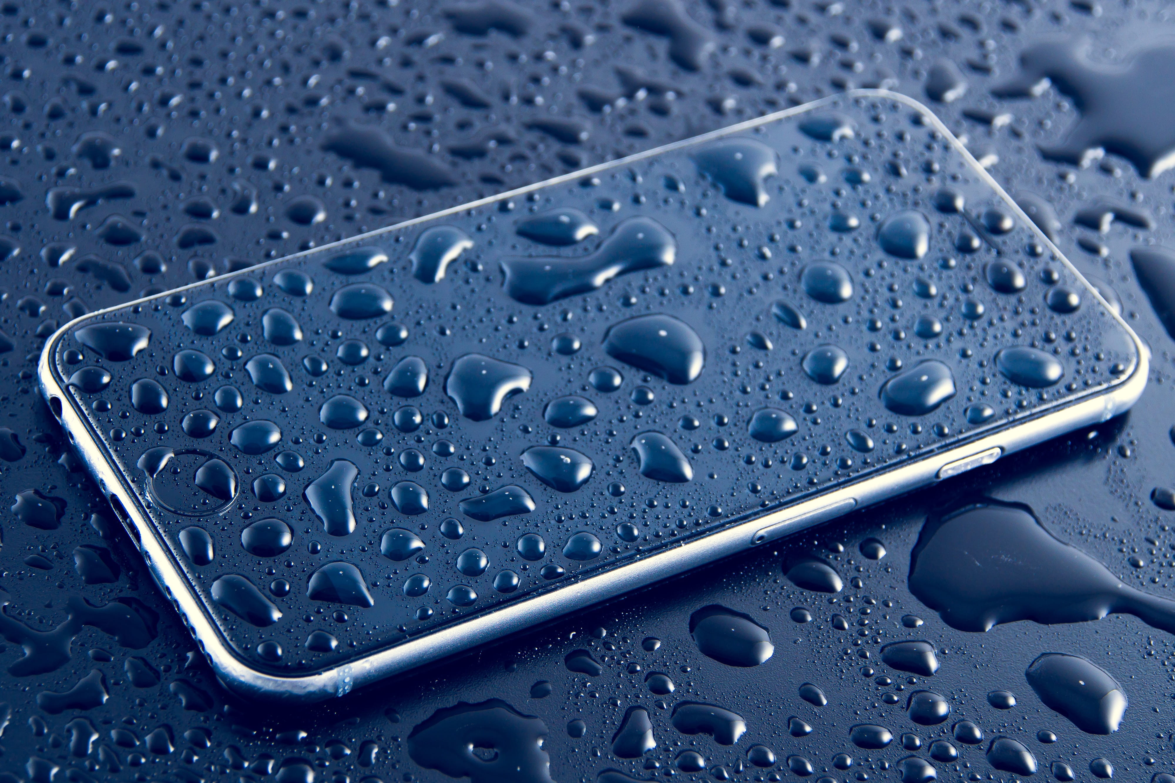 Wet mobile iPhone smartphone with water drops technology business 2k 4k