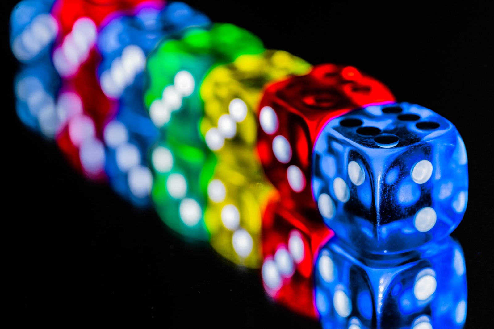 blue green red and yellow dice on black surface HMM Colorful 2k 4k 5k
