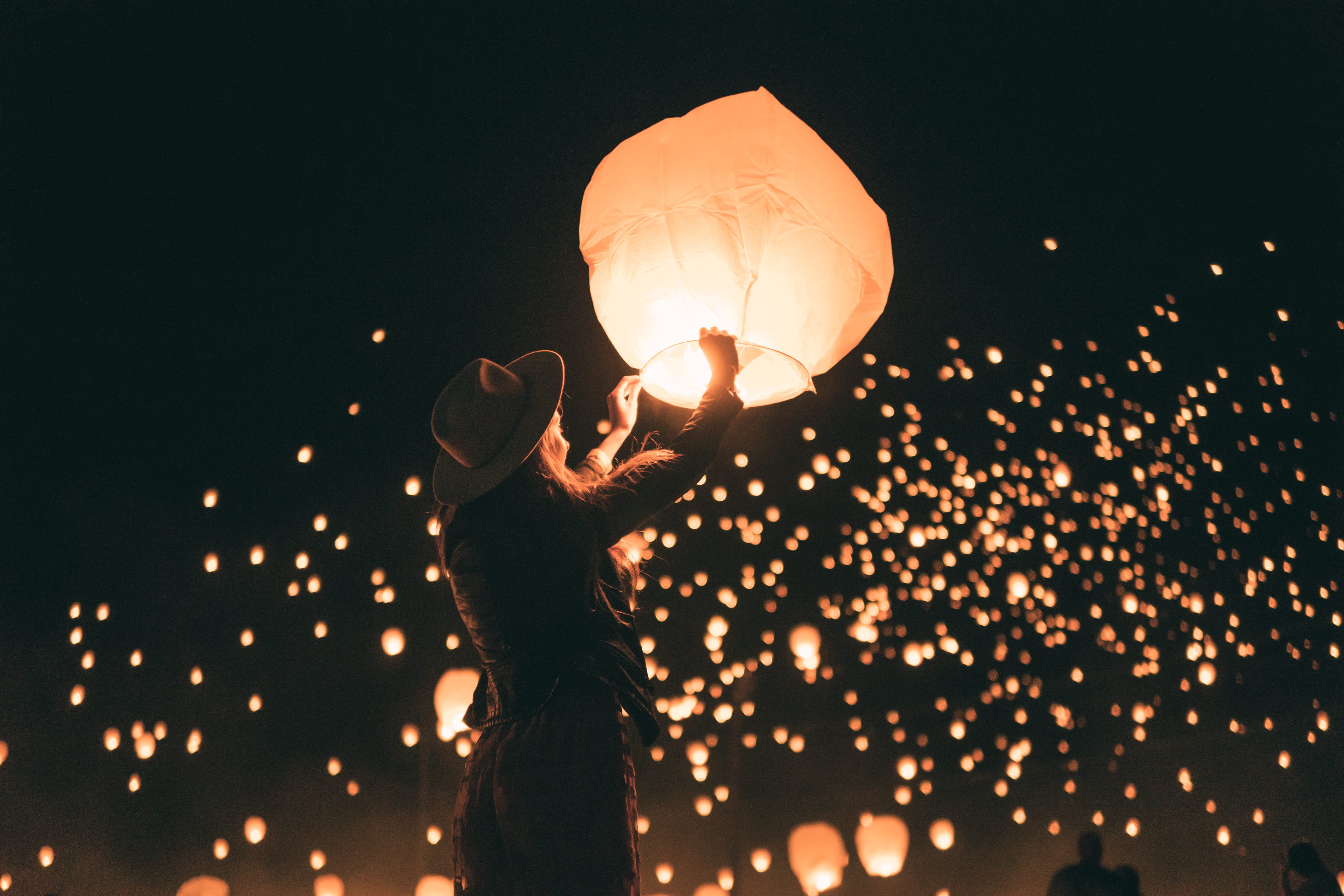 person holding lantern light night woman hat lady bokeh 2k 4k 5k
