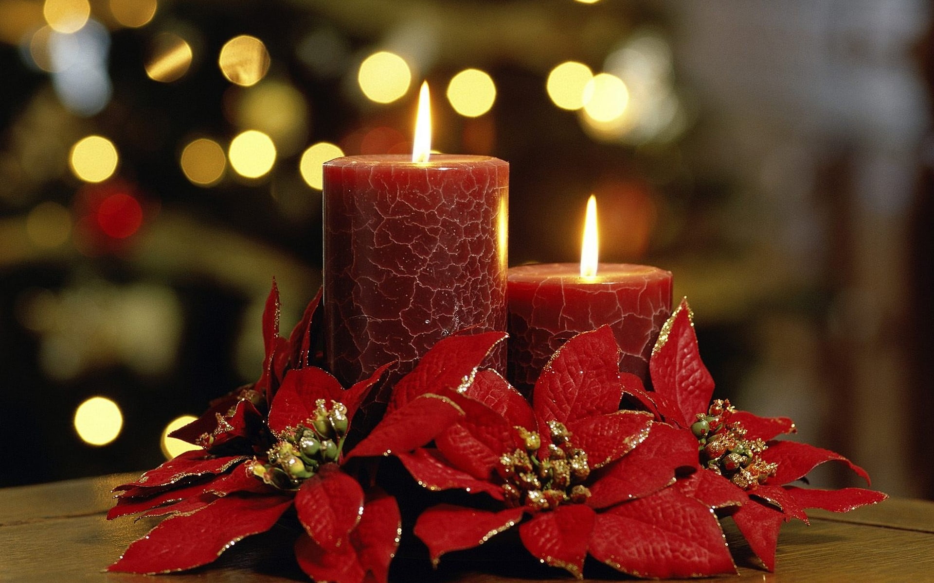 two red pillar candles flowers bokeh holiday Christmas decorations 2k