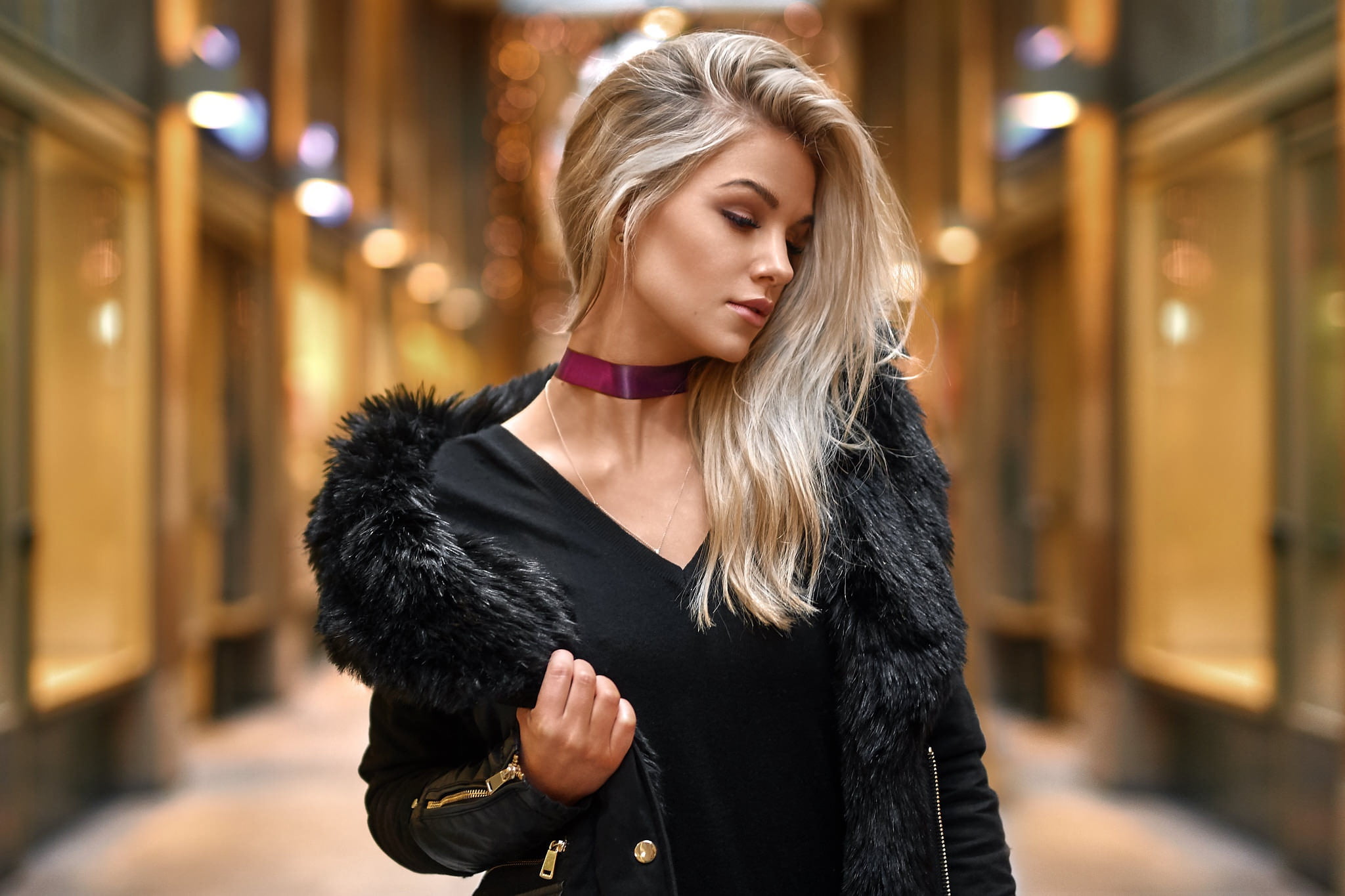 women s black V neck shirt and parka coat pose glare background 2k