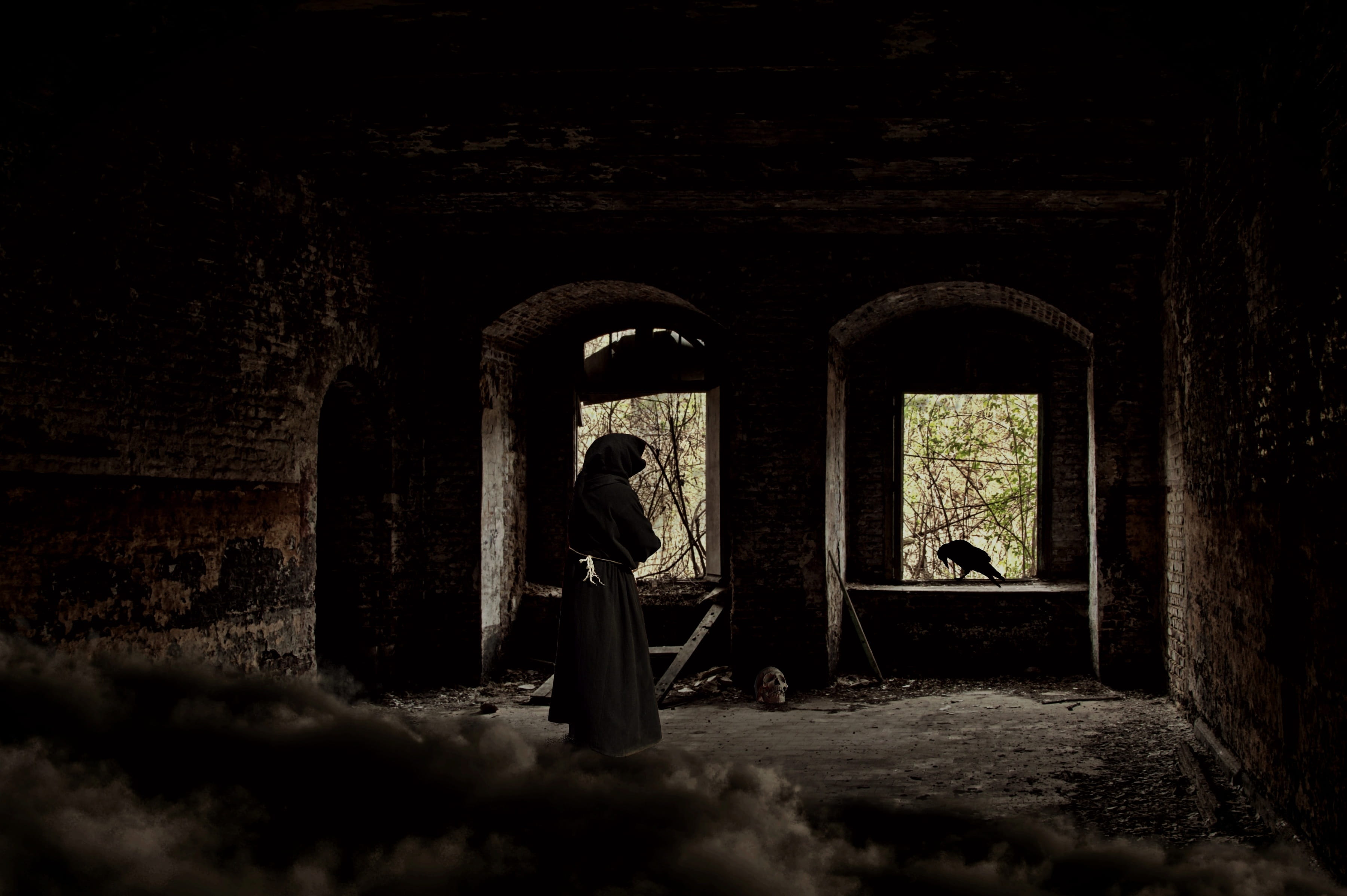 person wearing gray robe standing near window man ruin castle 2k 4k