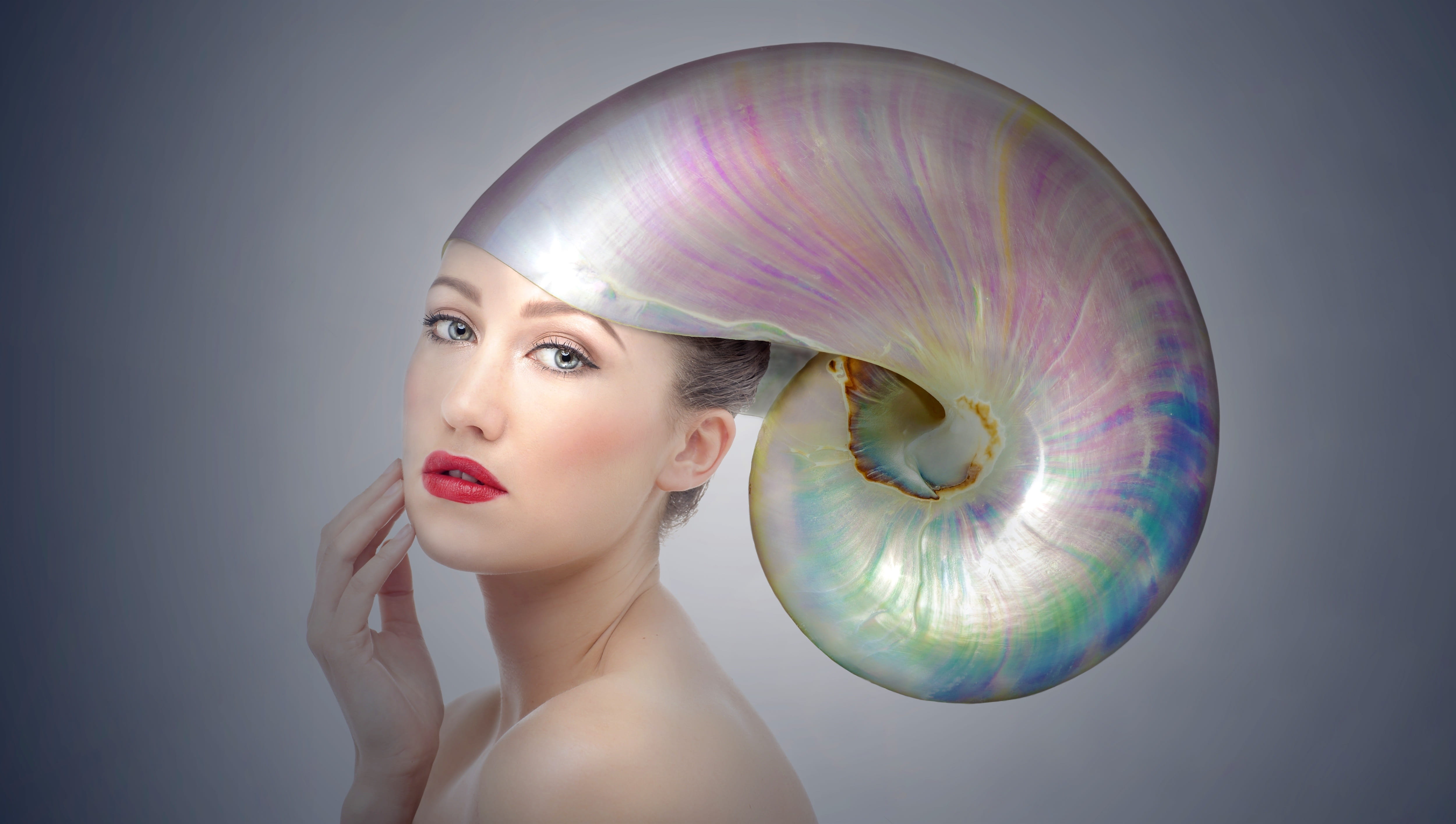 woman wearing iridescent snail hat portrait shell hood headdress 2k 4k 5k